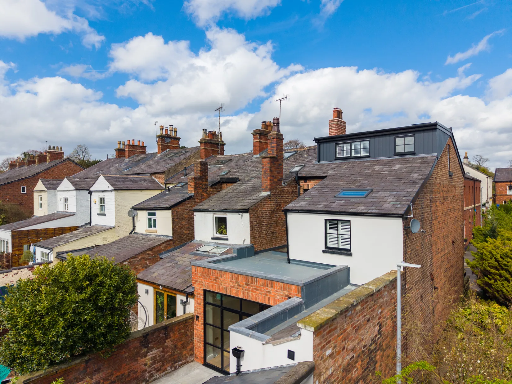 Elevated view of the rear extension and loft dormer among Macclesfield rooftops